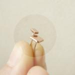 Mini stud earrings . Asymme..
