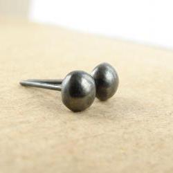 Small silver studs . Black oxidized sterling silver pebbles